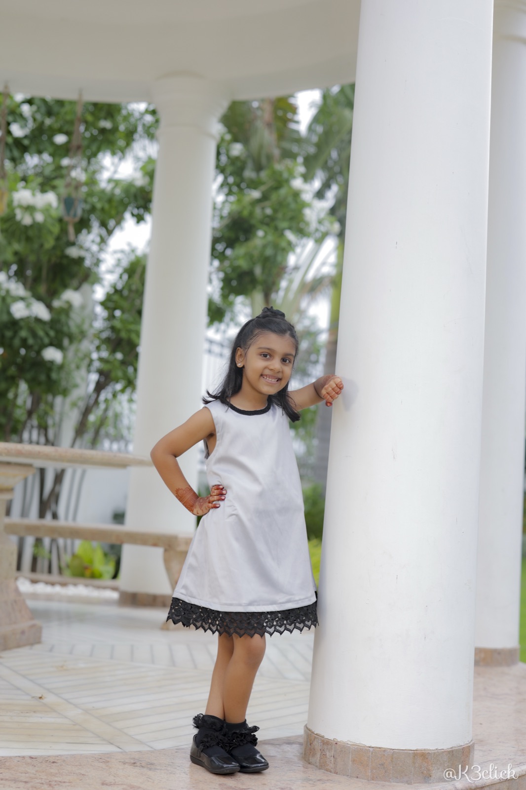 White dress with black lace hem